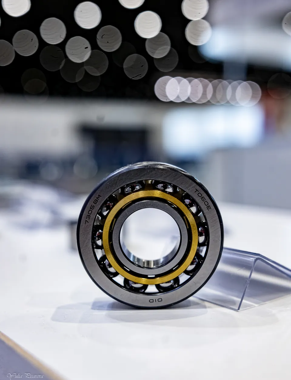 A bearing with a brass cage on display