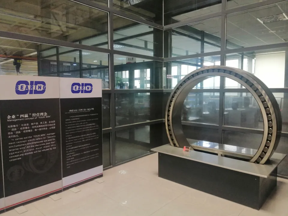 A large bearing on a stand next to OID information panels