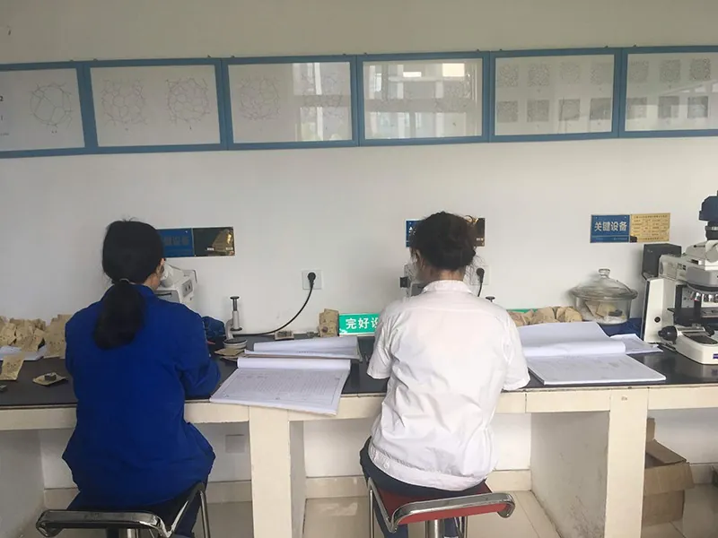 Specialists at a workbench in the measuring laboratory