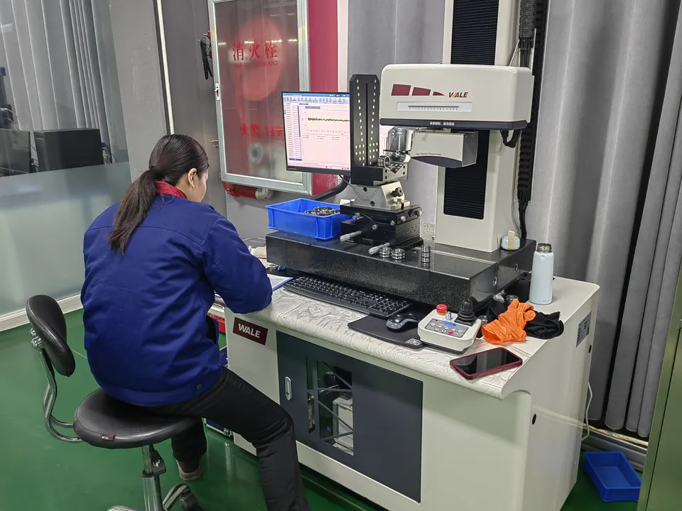 A specialist working with a measuring instrument and a computer